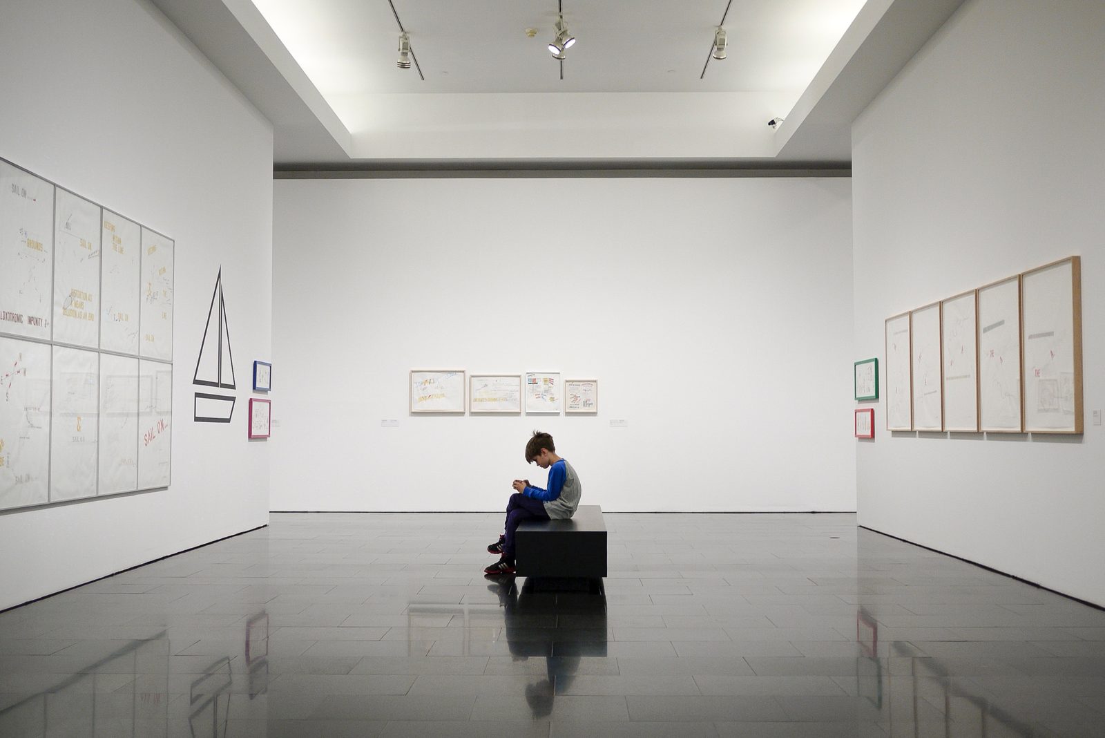 Young boy engaging with a museum exhibit